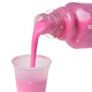pouring-dose-of-pink-medicine-A4NBNF.jpg